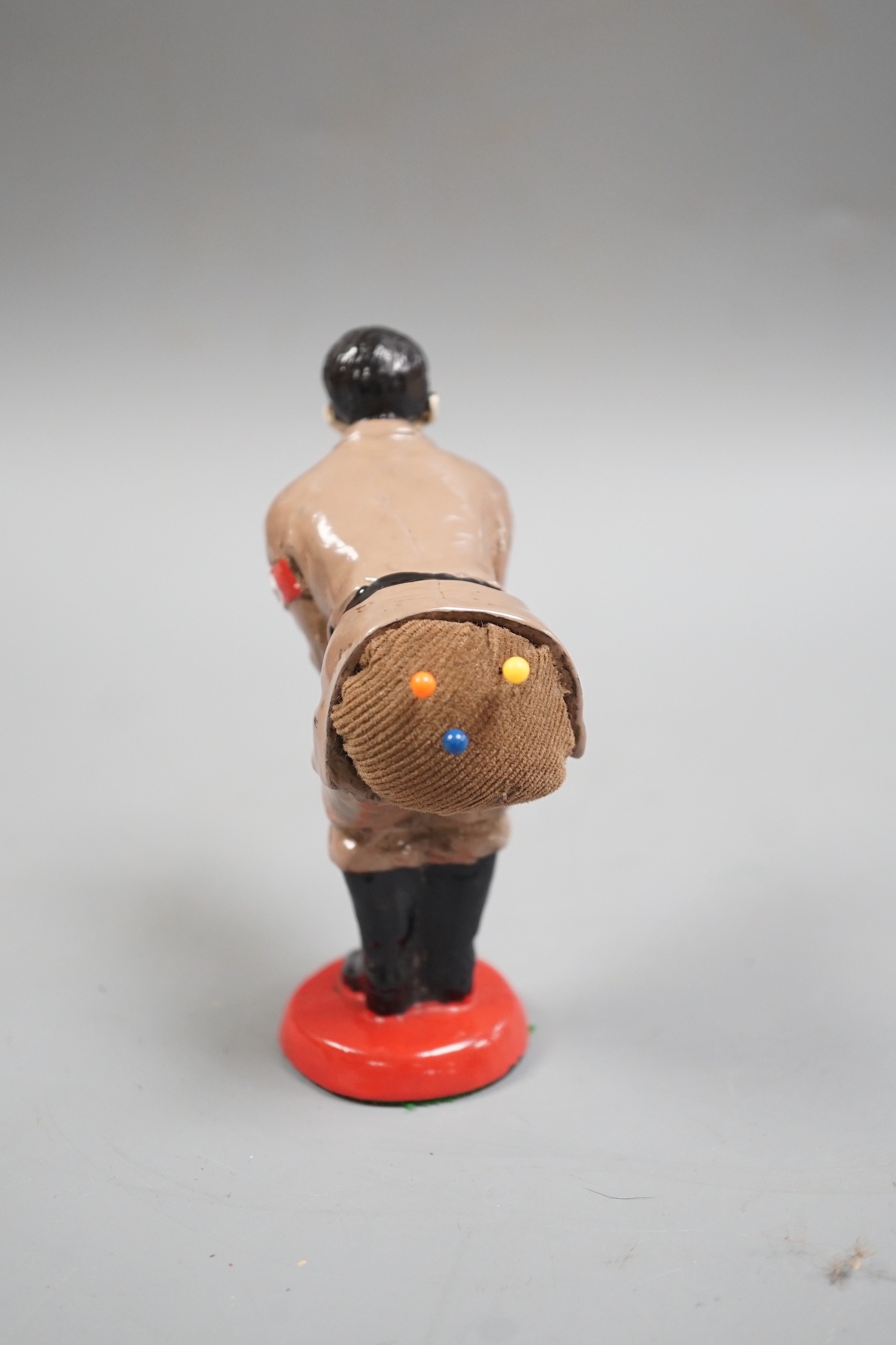 A painted metal ‘Adolf Hitler’ pin-cushion, 12cm